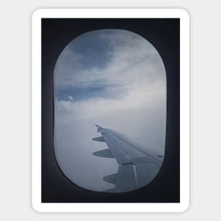 Plane flight through the dense clouds Sticker